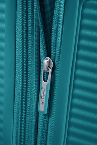 American Tourister Soundbox Spinner - expanderbar resväska 55 cm - grön