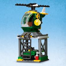 LEGO 76944 Jurassic Worl detaljert flyplass med garasje til helikopter og buggy-bil