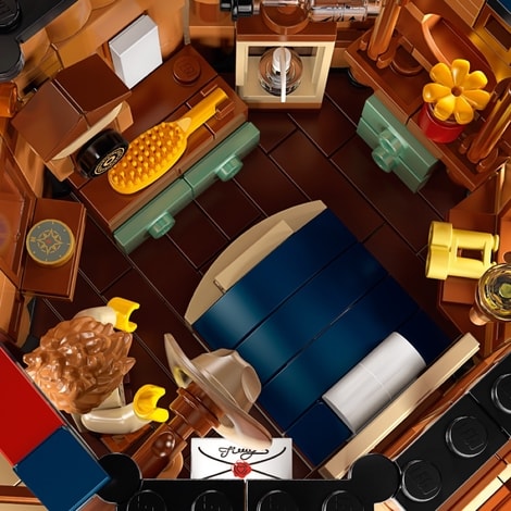 en seng, der kan bygges i soveværelsesafsnittet i LEGO Ideas Trætophus